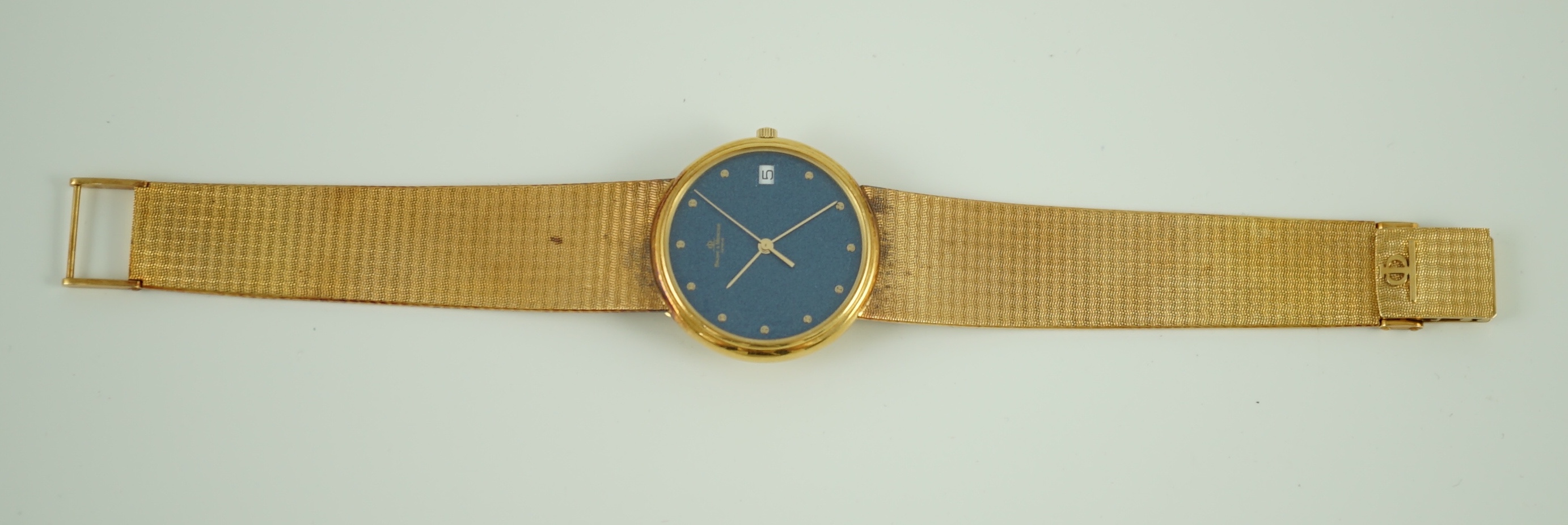 A gentleman's 1980's 18k gold Baume & Mercier quartz dress wrist watch, on a Baume & Mercier 18k gold bracelet